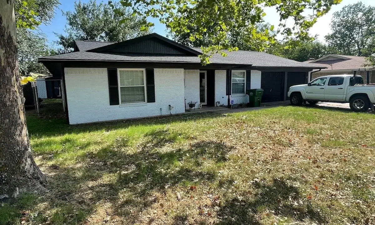 Professional roofing crew working on a residential roof in Dakota Dunes